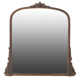 Antique brass overmantle mirror with ornate curved frame. Carved-effect resin design. Available online or in-store at Lily Bloom, Gorey, Ireland.