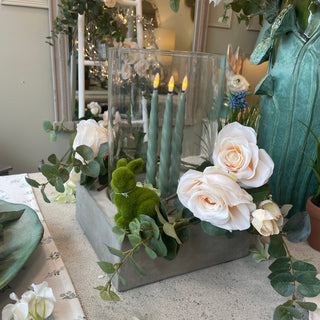 concrete hurricane lantern with white rose and eucalyptus wreath and LED candles – available at Lily Bloom, Gorey, Ireland