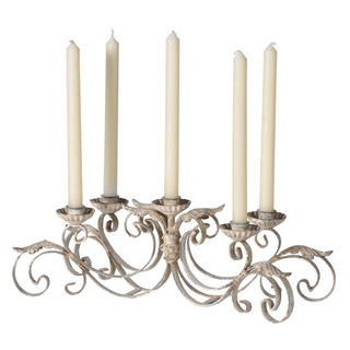 Aged French-style metal candelabra with ornate scroll detailing and five taper candle holders. Elegant distressed finish. Available at www.lilybloom.ie or in-store at Lily Bloom, Gorey, Ireland.