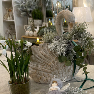 Seasonal display with swan vase, winter foliage and faux snowdrop plant crafted by Collette. Buy online at www.lilybloom.ie.