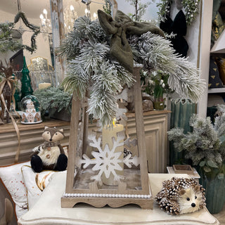 Brunswick Rustic Lantern Display with wooden fret-cut lantern, snowy greenery, LED candle and Lily Bloom bow. Buy online at www.lilybloom.ie