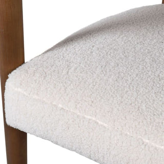 Close up of fabric: Bernard white bouclé curved dining chair with ash wood frame – available at Lily Bloom, Gorey, Ireland.