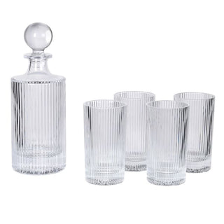 A clear glass decanter with a ribbed fluted design and a round stopper, shown alongside four matching ribbed drinking glasses on a plain white background.