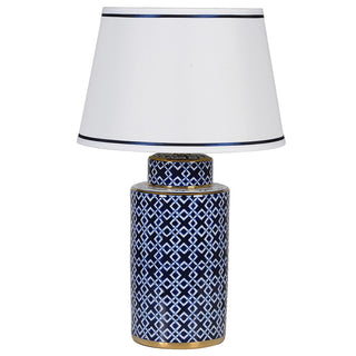 Blue and gold geometric porcelain table lamp with white shade and navy trim – available at Lily Bloom, Gorey, Ireland.