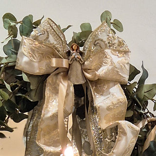 Close-up of gold ribbon and fairy accent on Annagh Swag – elegant seasonal décor from Lily Bloom Gorey