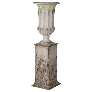 Tall distressed metal planter with plinth in aged iron finish – available at Lily Bloom, Gorey, Ireland