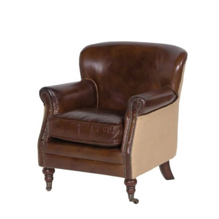 Denis vintage leather and linen armchair – compact club chair with rich brown leather and natural linen sides. Available at Lily Bloom, Gorey, Ireland.