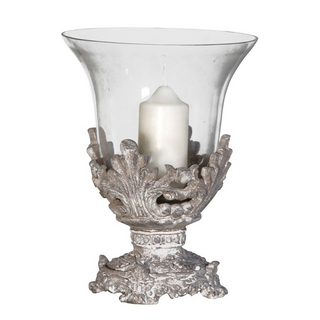 Elegant candleholder with flared glass hurricane and antique-style base – available at Lily Bloom, Gorey, Ireland