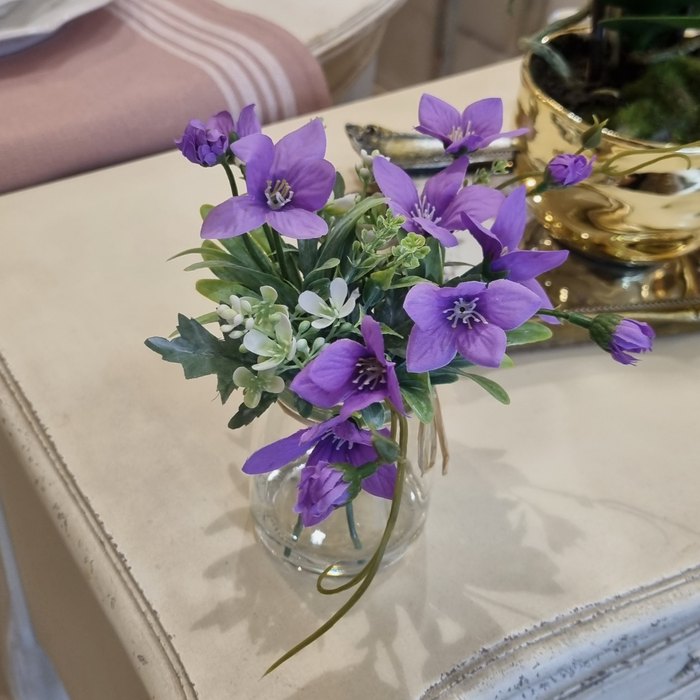 Purple Spring Flowers in Glass Vase
